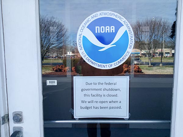 The NOAA building on South Illinois Avenue, shown above on Friday, Jan. 11, 2019, has a sign posted on the front door announcing that it is closed due to the partial shutdown of the federal government. (Photo by John Huotari/Oak Ridge Today)