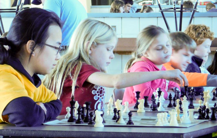 Linden Elementary School fourth-grader William Hetrick, center, makes a move during the Region 1 chess scholastic at Oak Ridge High School on Saturday, Jan. 26, 2019. (Submitted photo)