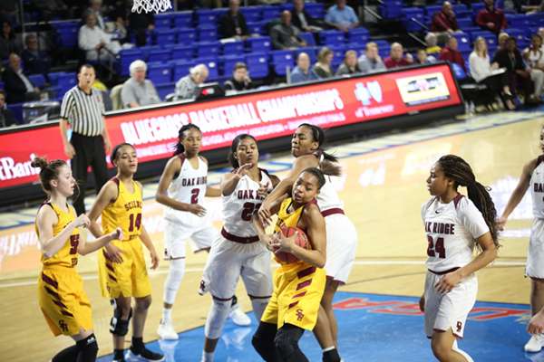 Science Hill and Oak Ridge battle for a rebound during a 65-49 Lady Wildcats win over the Lady Hilltoppers in a Class AAA girls basketball tournament quarterfinal game in Murphy Center at Middle Tennessee State University in Mufreesboro on Thursday, March 7, 2019. (Photo by Luther Simmons)