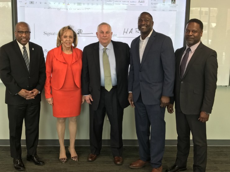 ORAU and the Thurgood Marshall College Fund have joined forces to expand STEM research opportunities for students and faculty at historically black colleges and universities. On hand to sign a memorandum of understanding on March 29, 2019, were, left to right, Harry Williams, president of TMCF; Joyce Payne, founder; Andy Page, ORAU president and CEO; Desmond Stubbs, ORAU director of diversity initiatives; and Michael Stubblefield, vice chancellor for research and strategic initiatives at Southern University and A&M College, an ORAU consortium member institution. (Photo by ORAU)