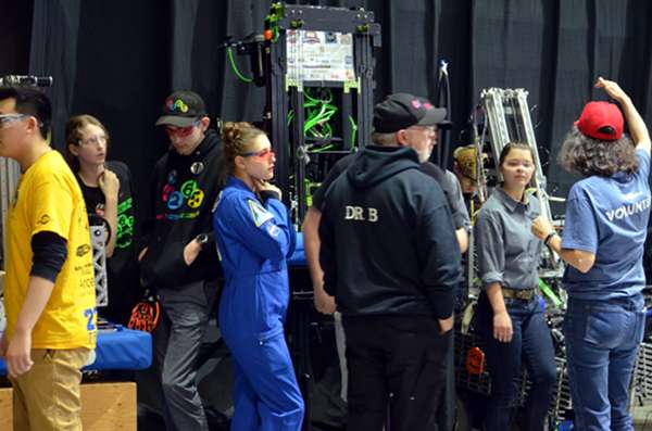 Among those pictured above are Mack Patrick, Patience Sims, and Mark Buckner waiting to take the field during the Smoky Mountains Regionals robotics tournament in March 2019. (Photo by Angi Agle)