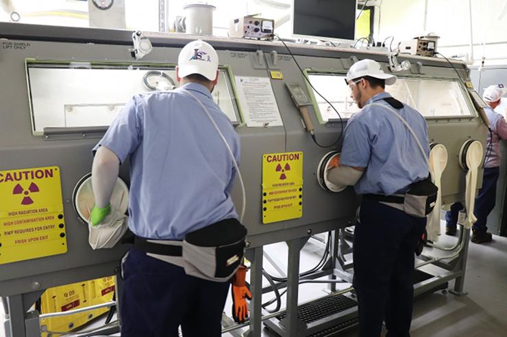 DOE EM ORNL Fissionable Material Handlers Working in Glovebox